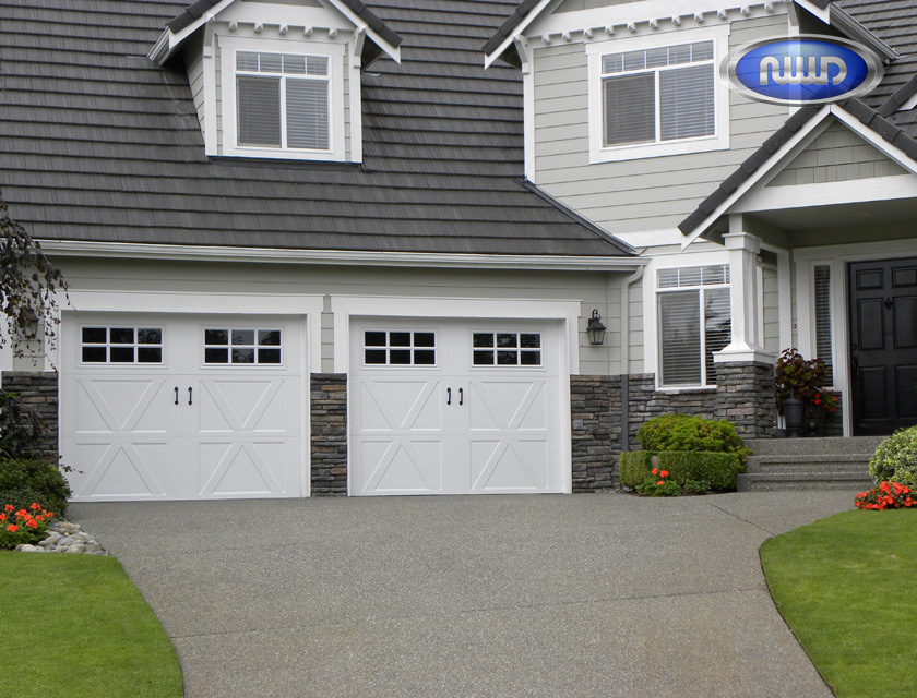 Elegant garage door with decorative windows, offering a sophisticated appearance to the property | Intermountain West Insulation
